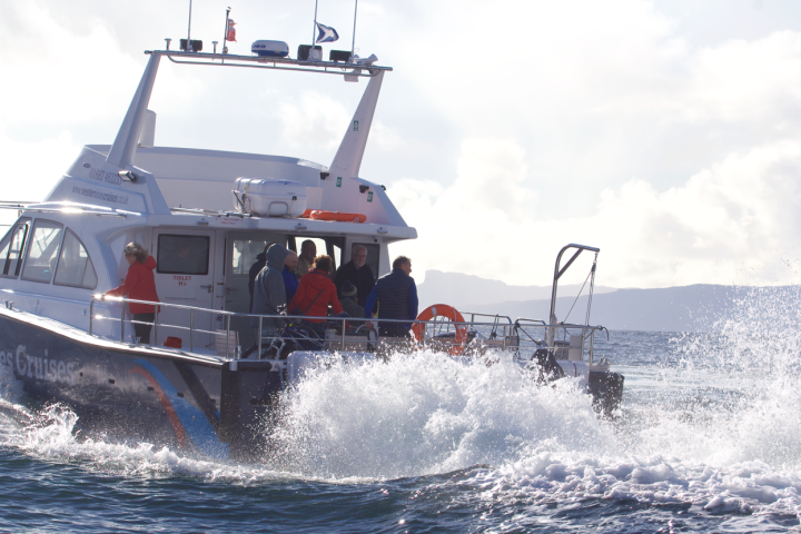 a man driving a boat in the water