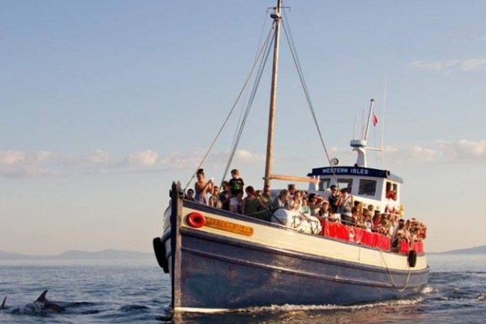 a small boat in a large body of water