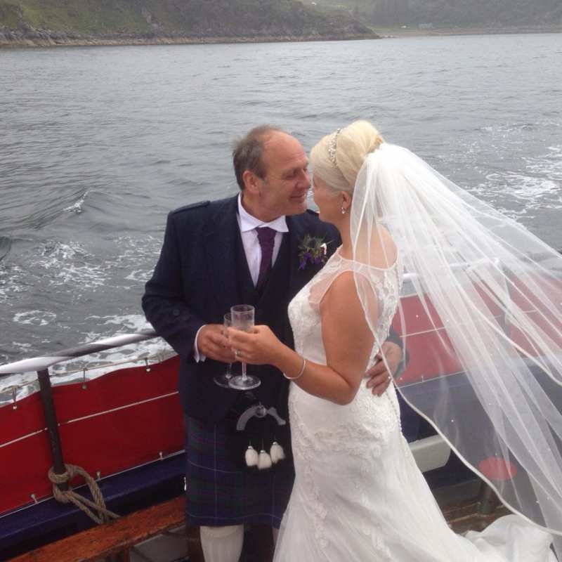 a man standing next to a body of water