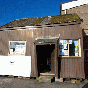 a truck is parked on the side of a building