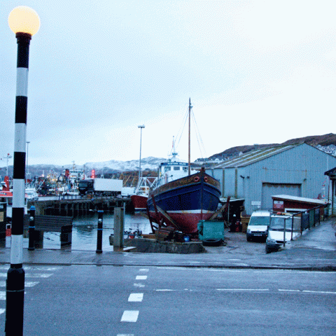 a clock on the side of a road