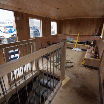 a kitchen with wooden cabinets and a window