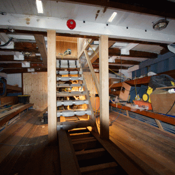 a wooden bench in a room
