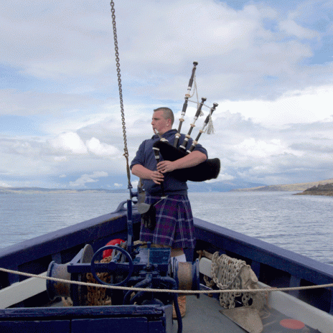 a man in a boat on a body of water