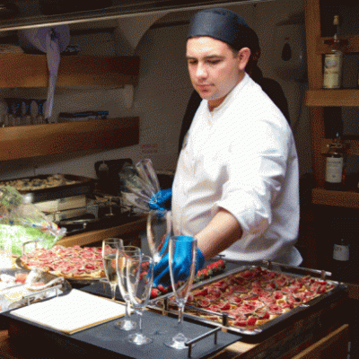 a man standing in a kitchen preparing food