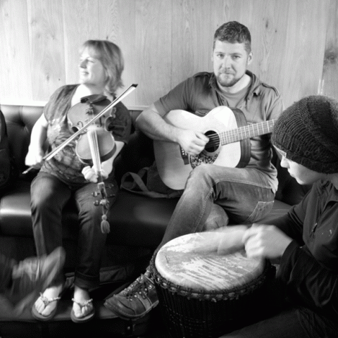 a group of people sitting in a chair