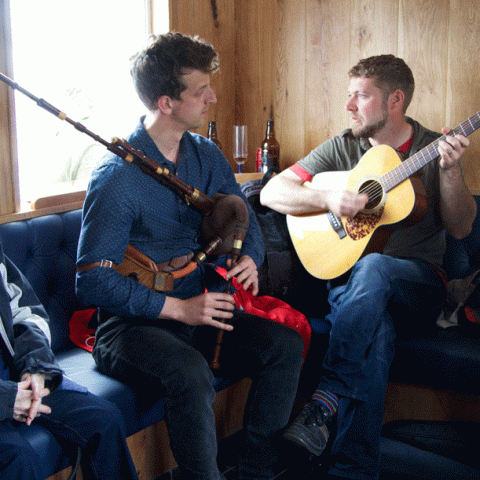 a man holding a guitar