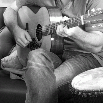 a man holding a guitar