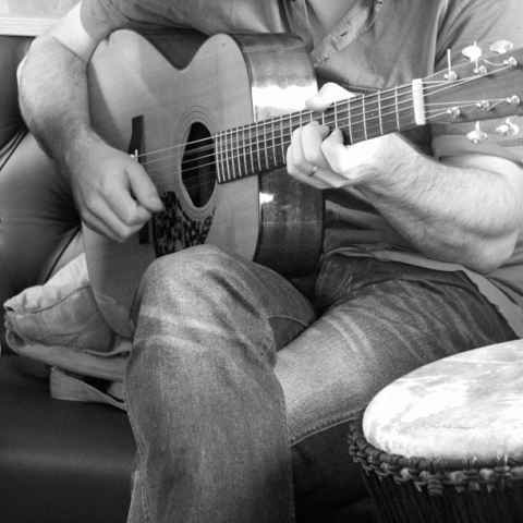 a man holding a guitar