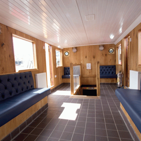 a room filled with furniture and a large window