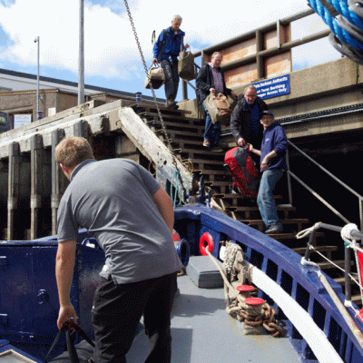 a man riding on the back of a boat