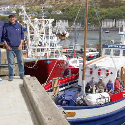 a group of people in a small boat in a body of water