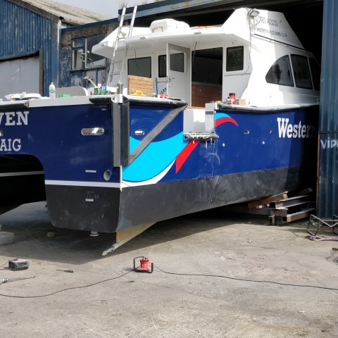 a blue truck parked in a parking lot