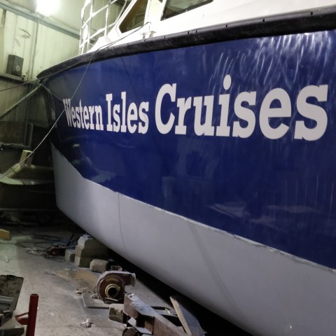 a plane parked on the side of a building