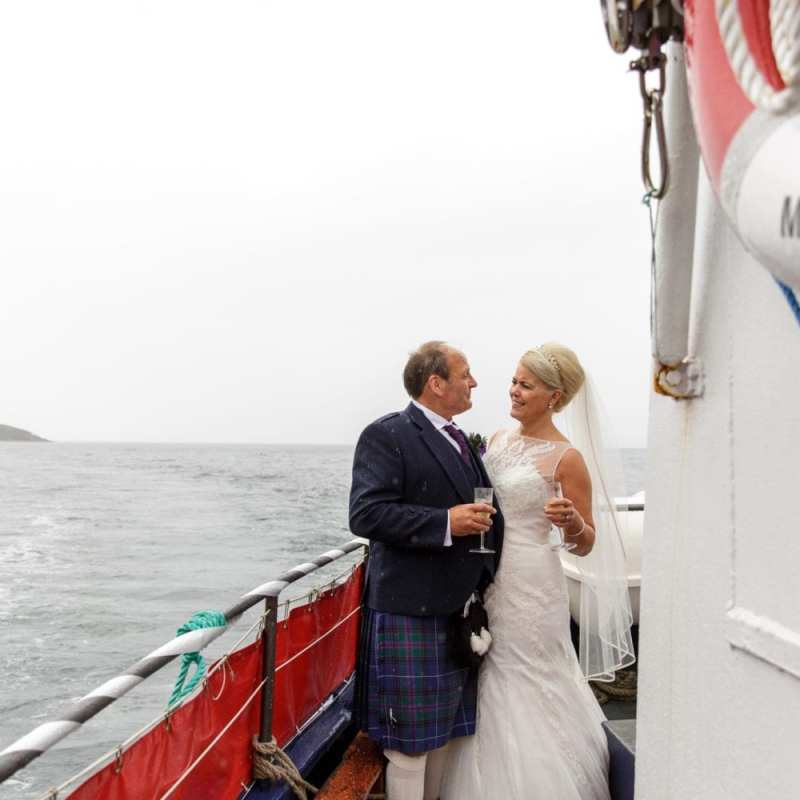 a person standing on a boat in the water