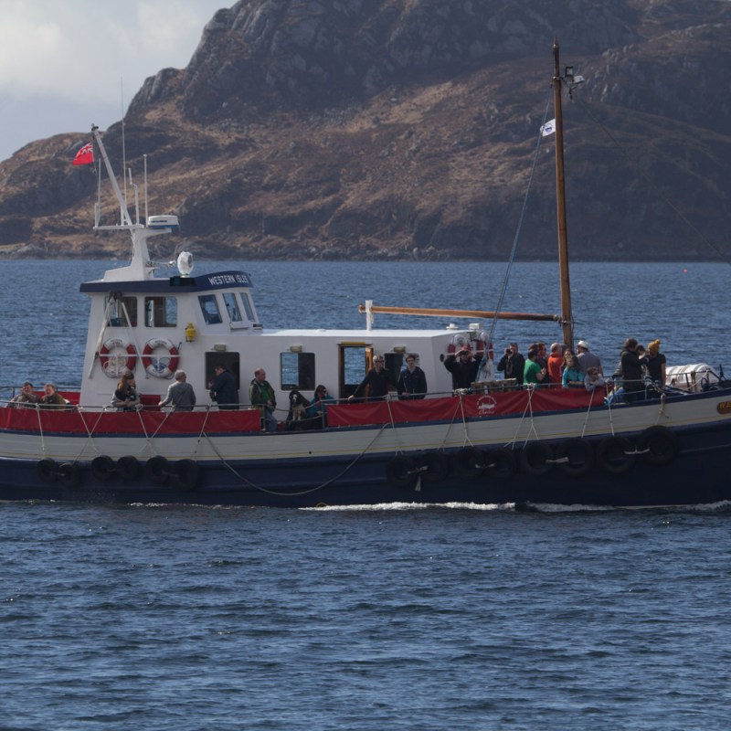 a small boat in a large body of water