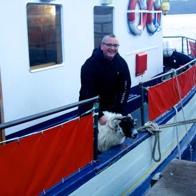 a man and a dog on a boat