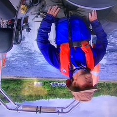 a person riding on the back of a boat