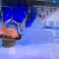 a person riding on the back of a boat