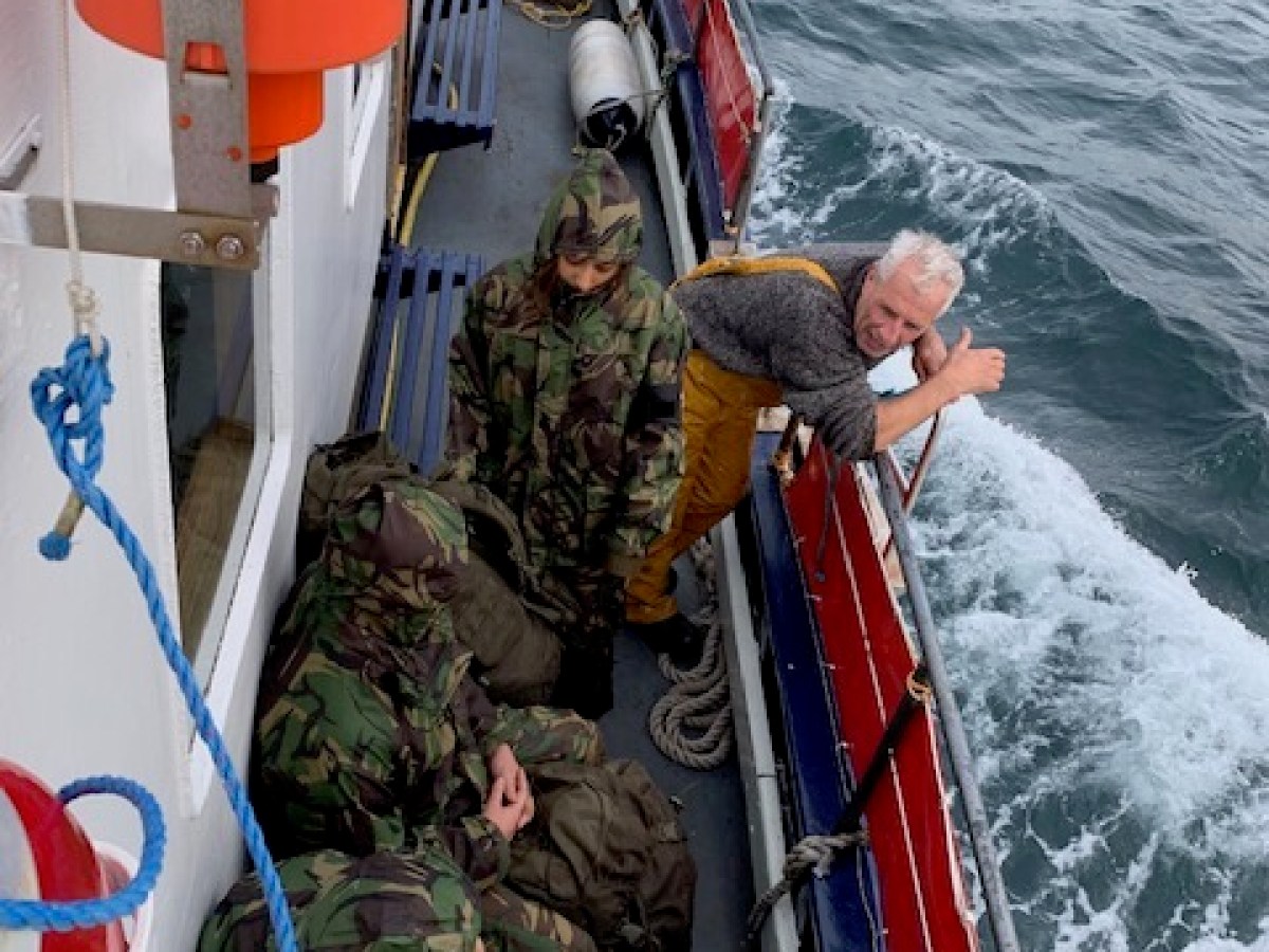 a group of people on a boat in the water