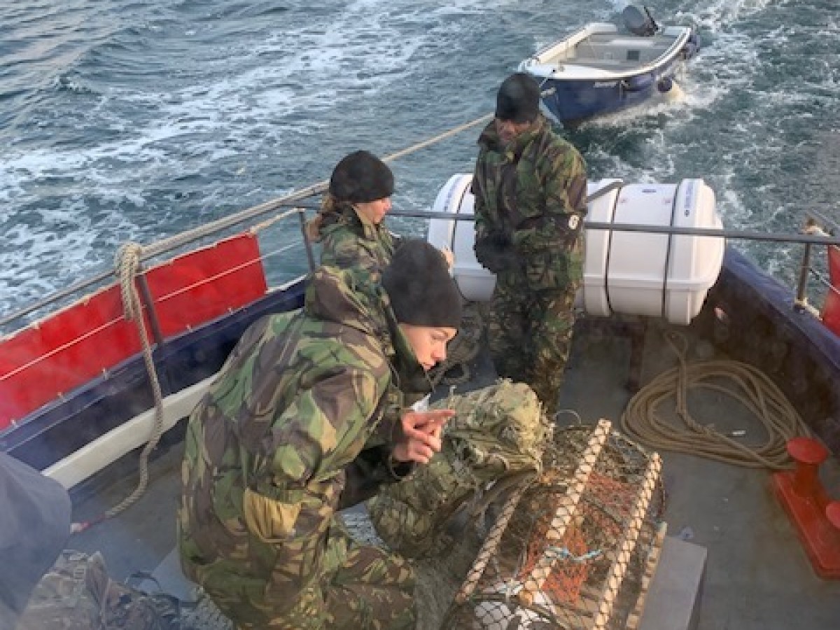 a group of people on a boat in the water