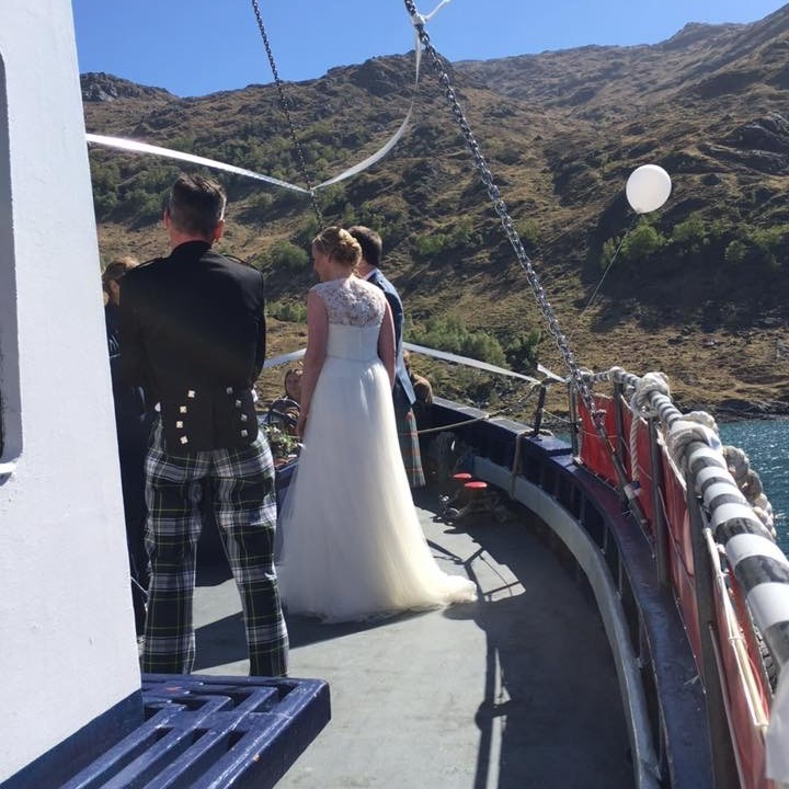 a group of people standing on a bridge