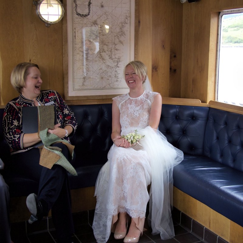 a man and a woman sitting on a bed