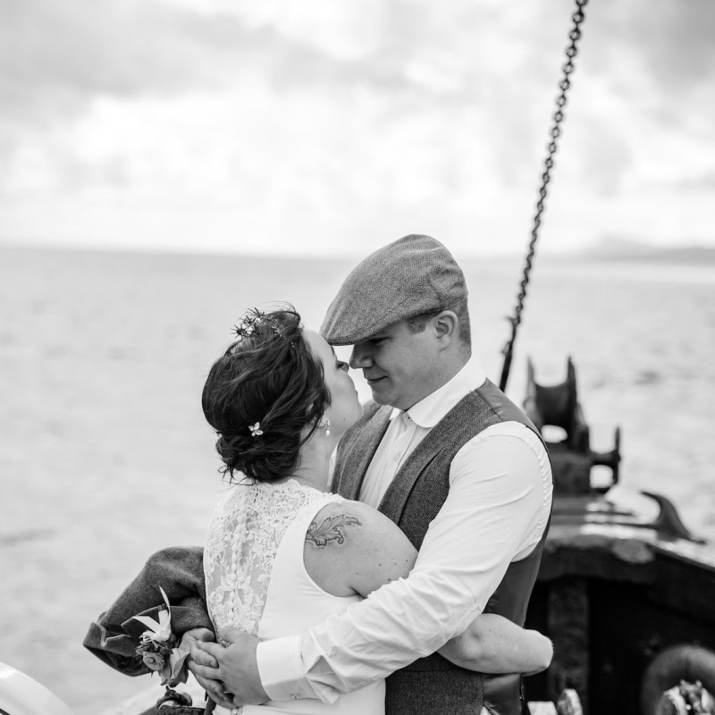 a person standing next to a body of water