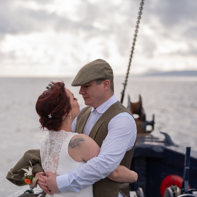 a person sitting in a boat on a body of water