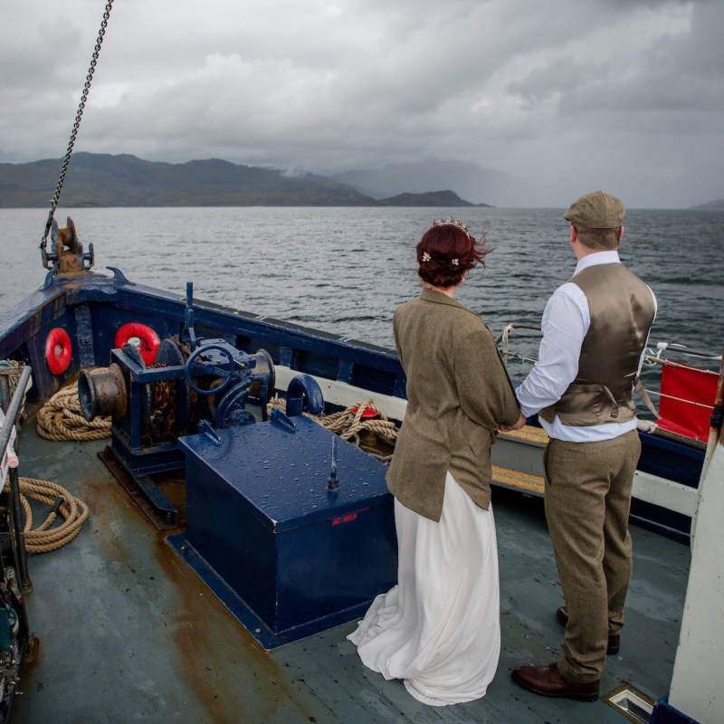 a man standing next to a boat