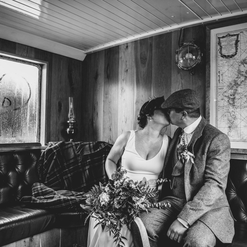 a woman sitting in a chair talking on the phone