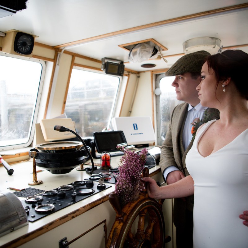 a woman standing in front of a window