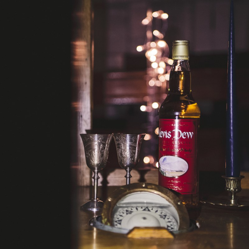 a glass of wine on a table