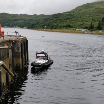 a boat parked next to a body of water