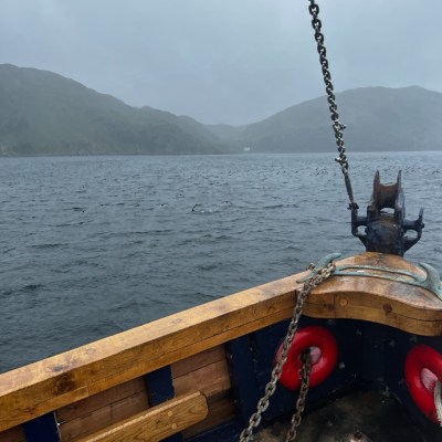a boat sitting on top of a body of water